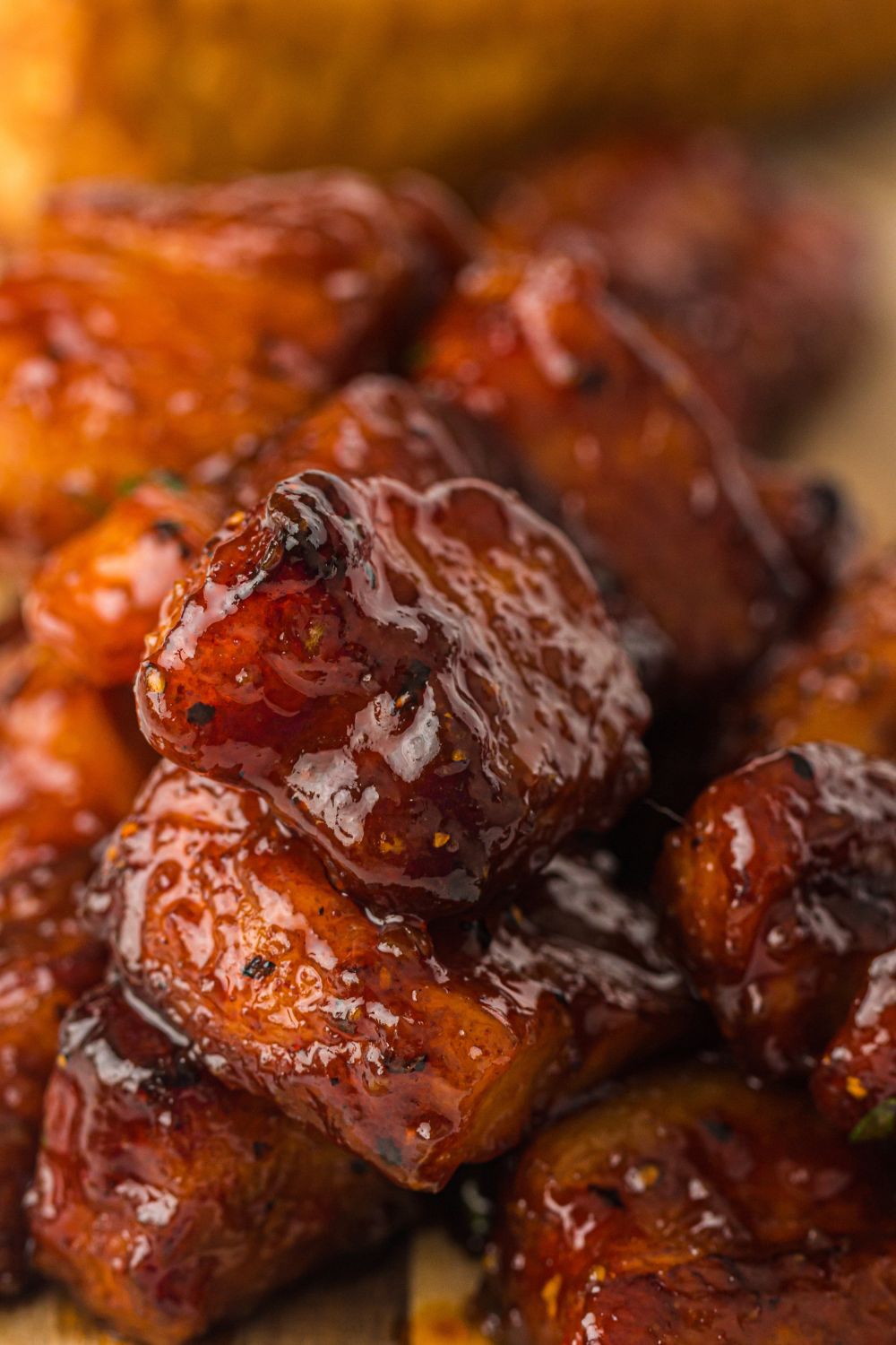 diced up Smoked Pork Belly Burnt Ends in a container 