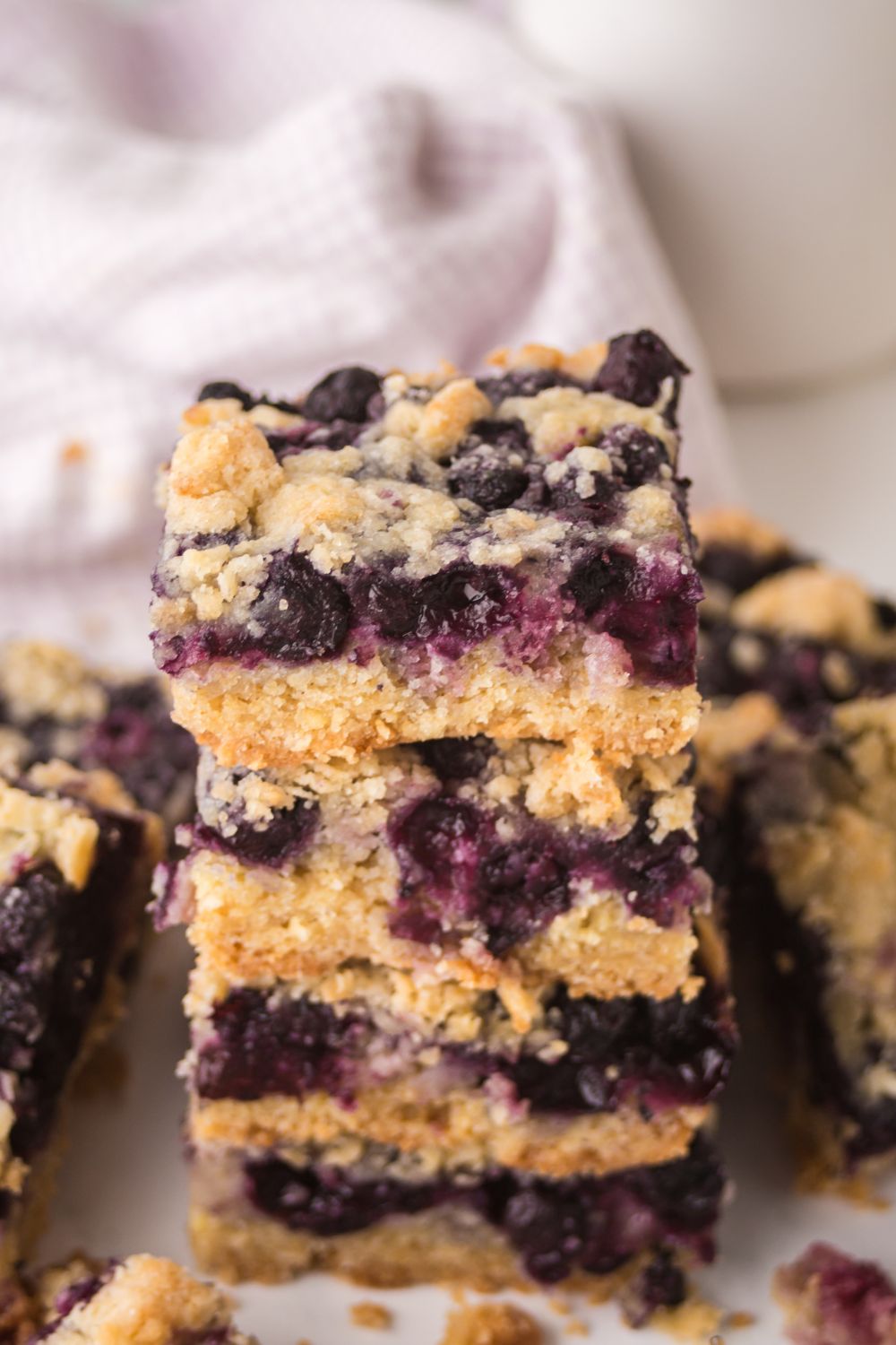 summer Blueberry Crumb Bars stacked on table 