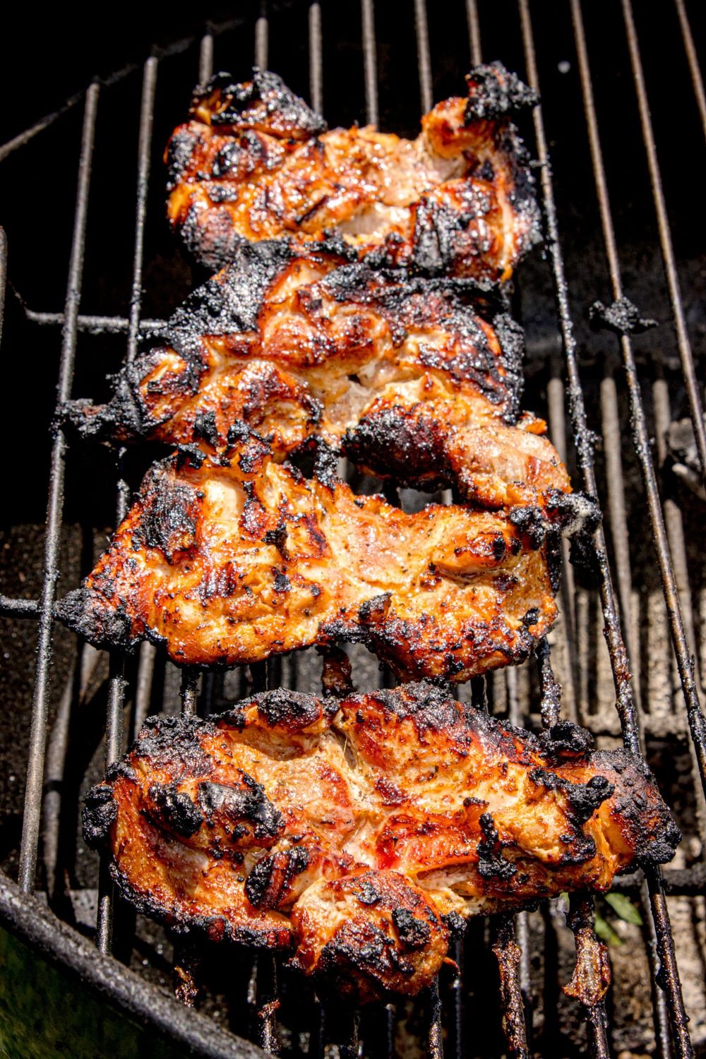 grilled chicken on a grill outside 