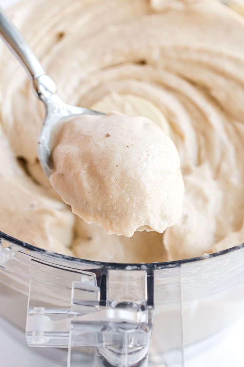 Banana Ice Cream in food processor with a spoonful 