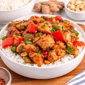 Better Than Takeout Kung Pao Chicken in a bowl with rice under it