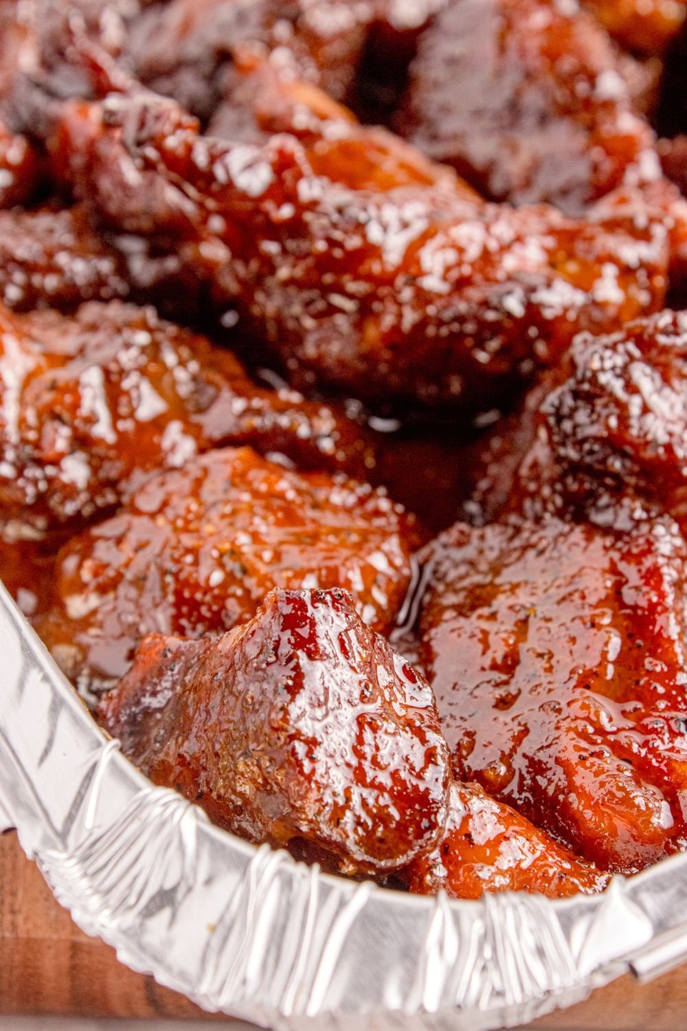 close up of Chuck Roast Burnt Ends in a pan sitting on table 