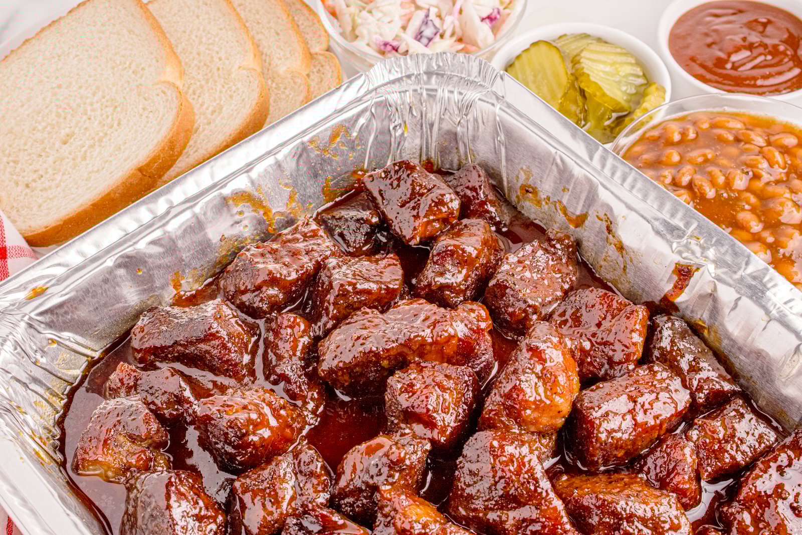 Chuck Roast Burnt Ends piled in a tin pan 