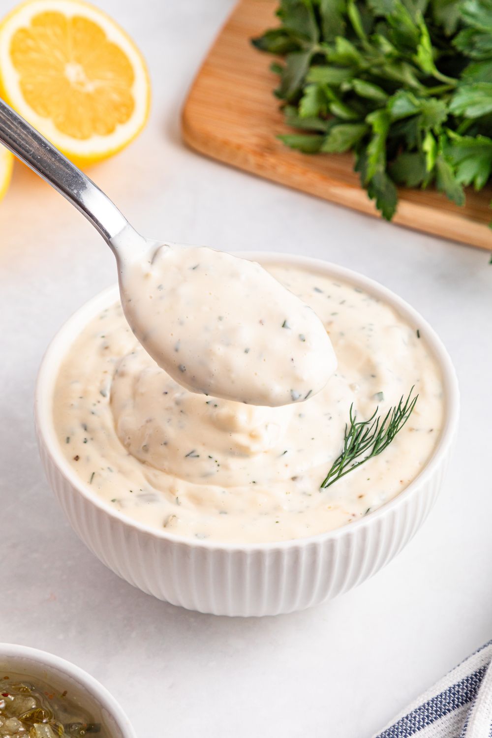 Easy Homemade Tarter Sauce in a bowl with some dill to the side 