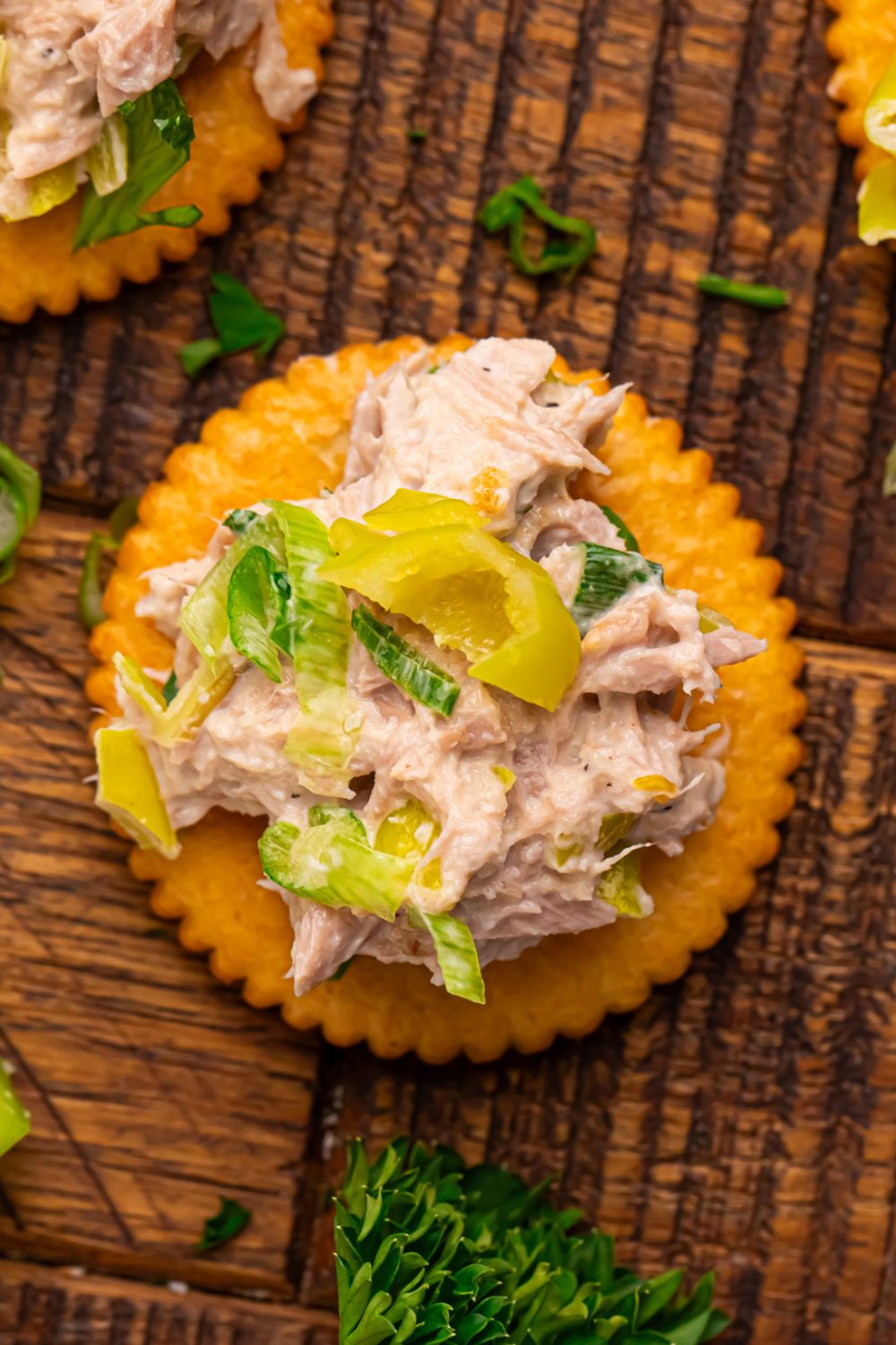 Pepperoncini Ranch Tuna Salad on top of a Ritz cracker sitting on table 