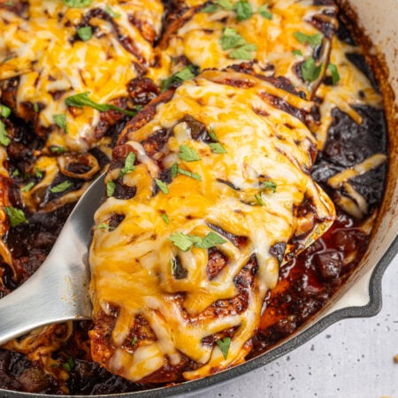 Cheesy Salsa Chicken in a white skillet