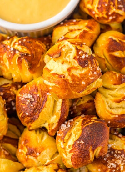 Easy Biscuit Pretzel Bites with Cheese Sauce on a tray