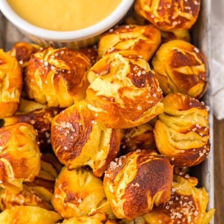 Easy Biscuit Pretzel Bites with Cheese Sauce on a tray