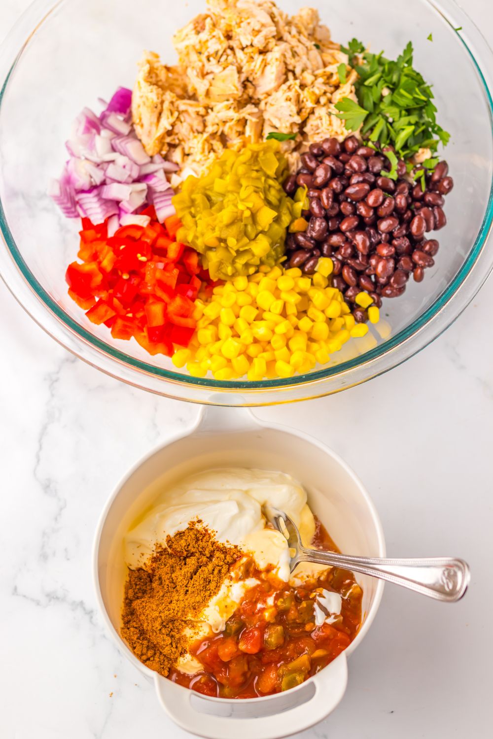 Creamy Taco Chicken Salad  ingredients in a bowl and the dressing in another small bowl 