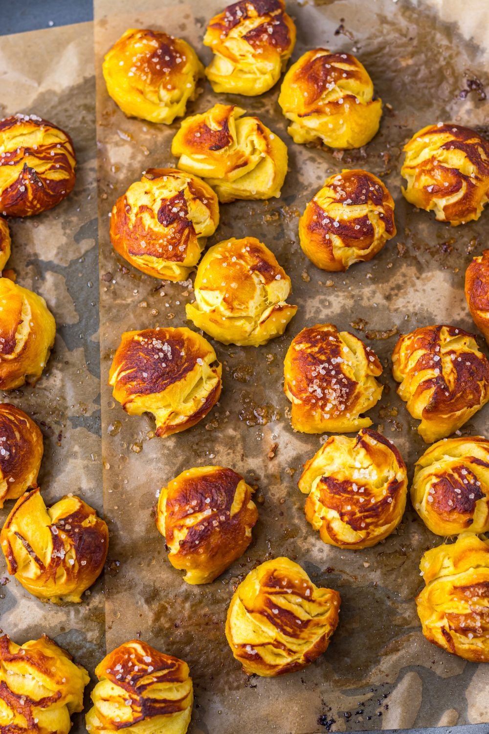 Easy Biscuit Pretzel Bites spread out on a baking sheet 