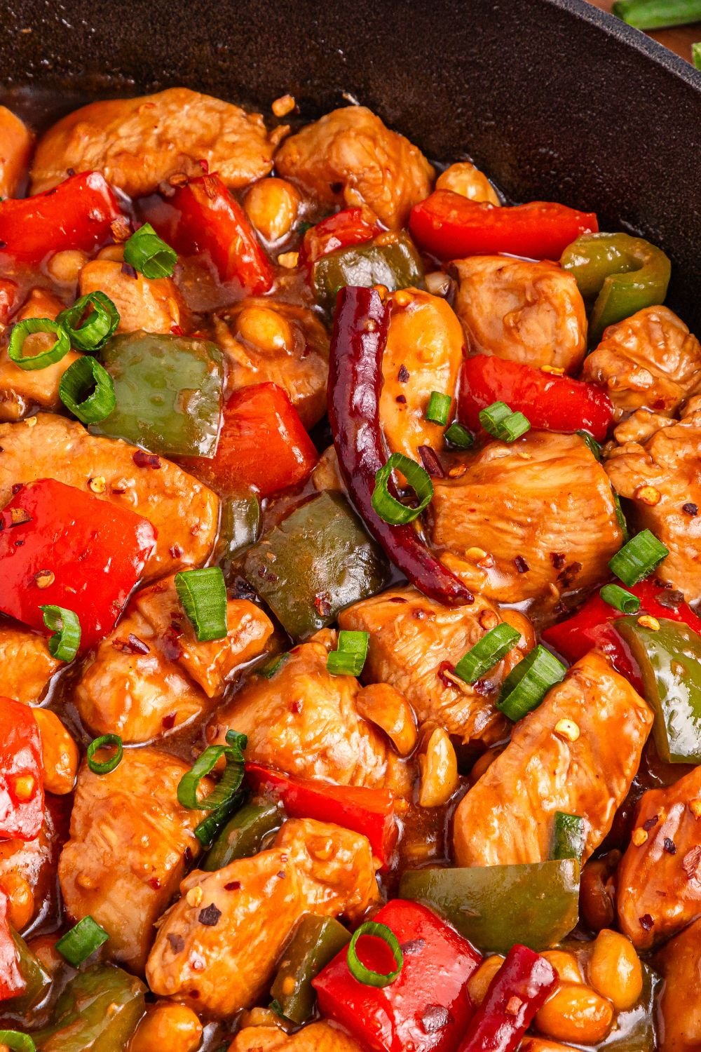 Better Than Takeout Kung Pao Chicken in a pan on stovetop 