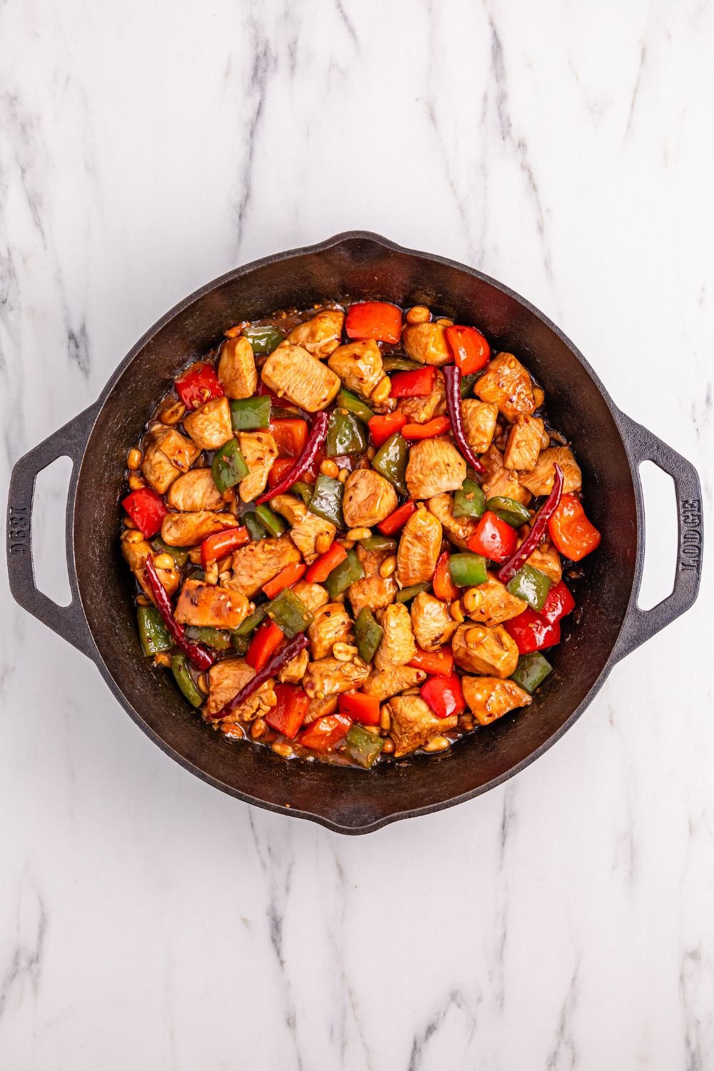 cooked Better Than Takeout Kung Pao Chicken in a cast iron skillet