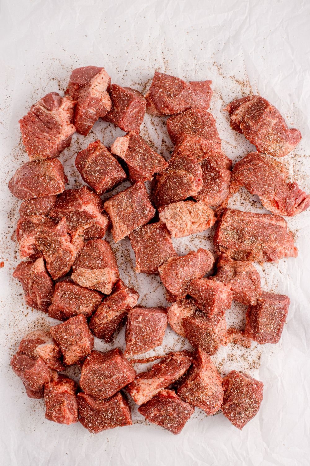 beef cut into cubes that have been seasoned 