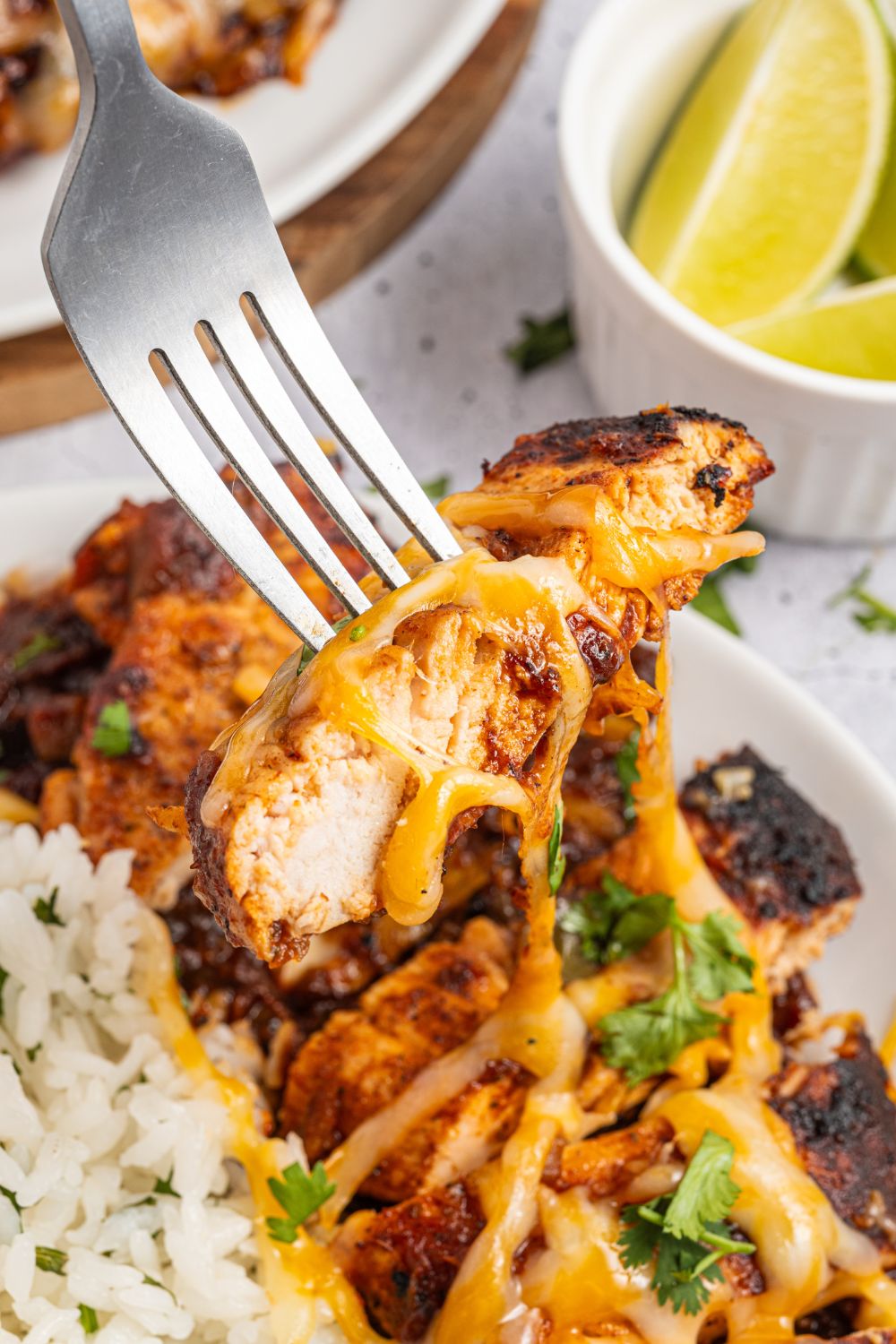 Cheesy Salsa Chicken on fork with cheese 