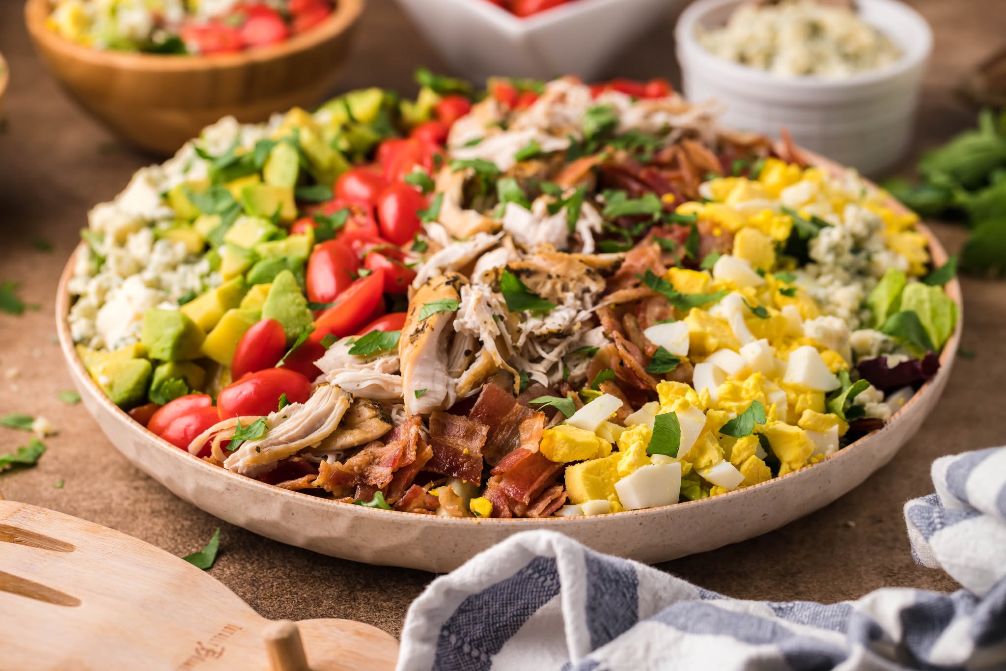 a large plate filled with the Copycat Cheesecake Factory Cobb Salad 