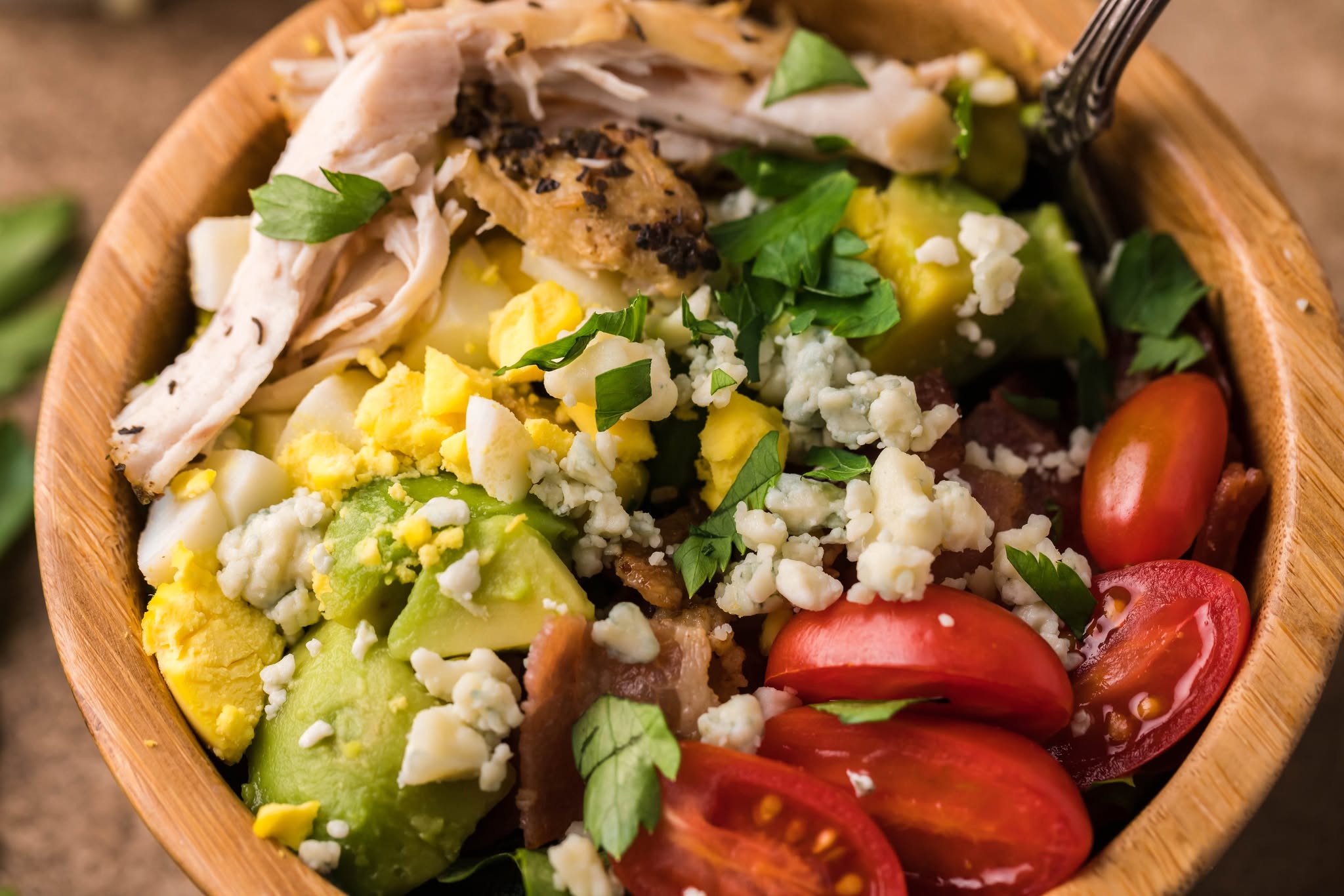 up close shot of the Copycat Cheesecake Factory Cobb Salad in a tiny salad bowl