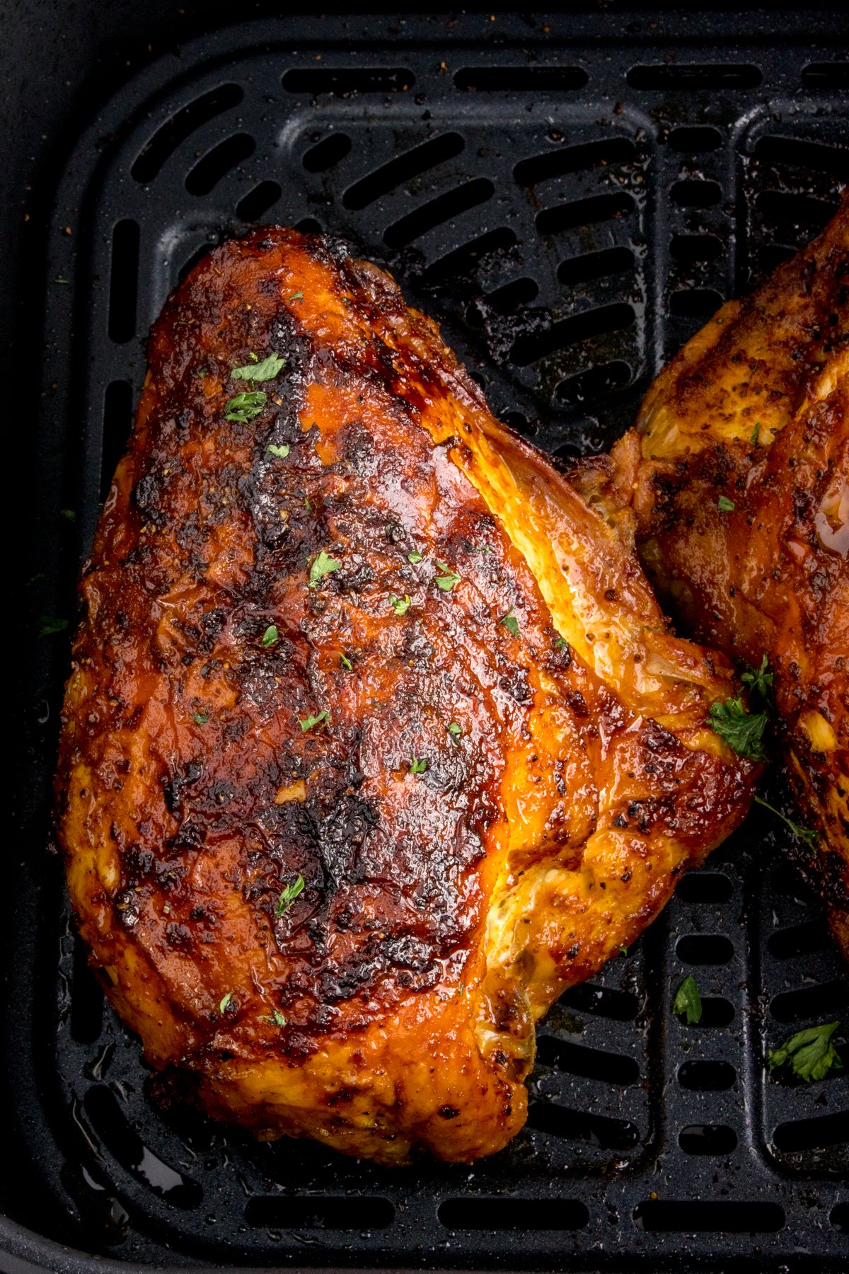 cooked Air Fryer Chicken Breast inside the air fryer basket 