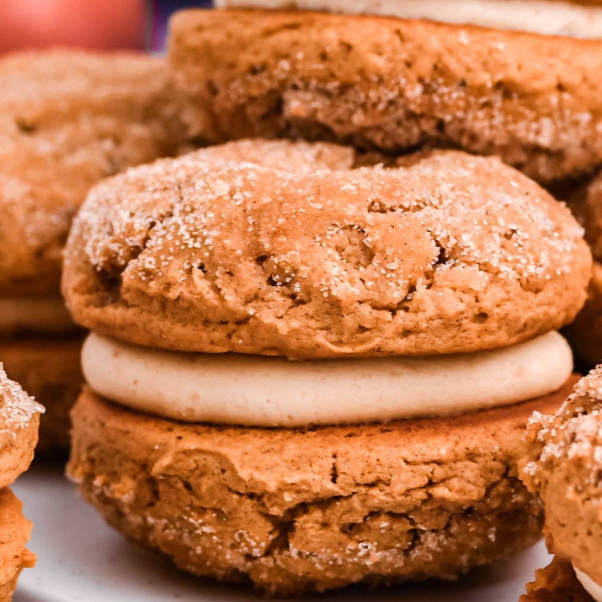 Apple Cider Whoopie Pies stacked on tables 