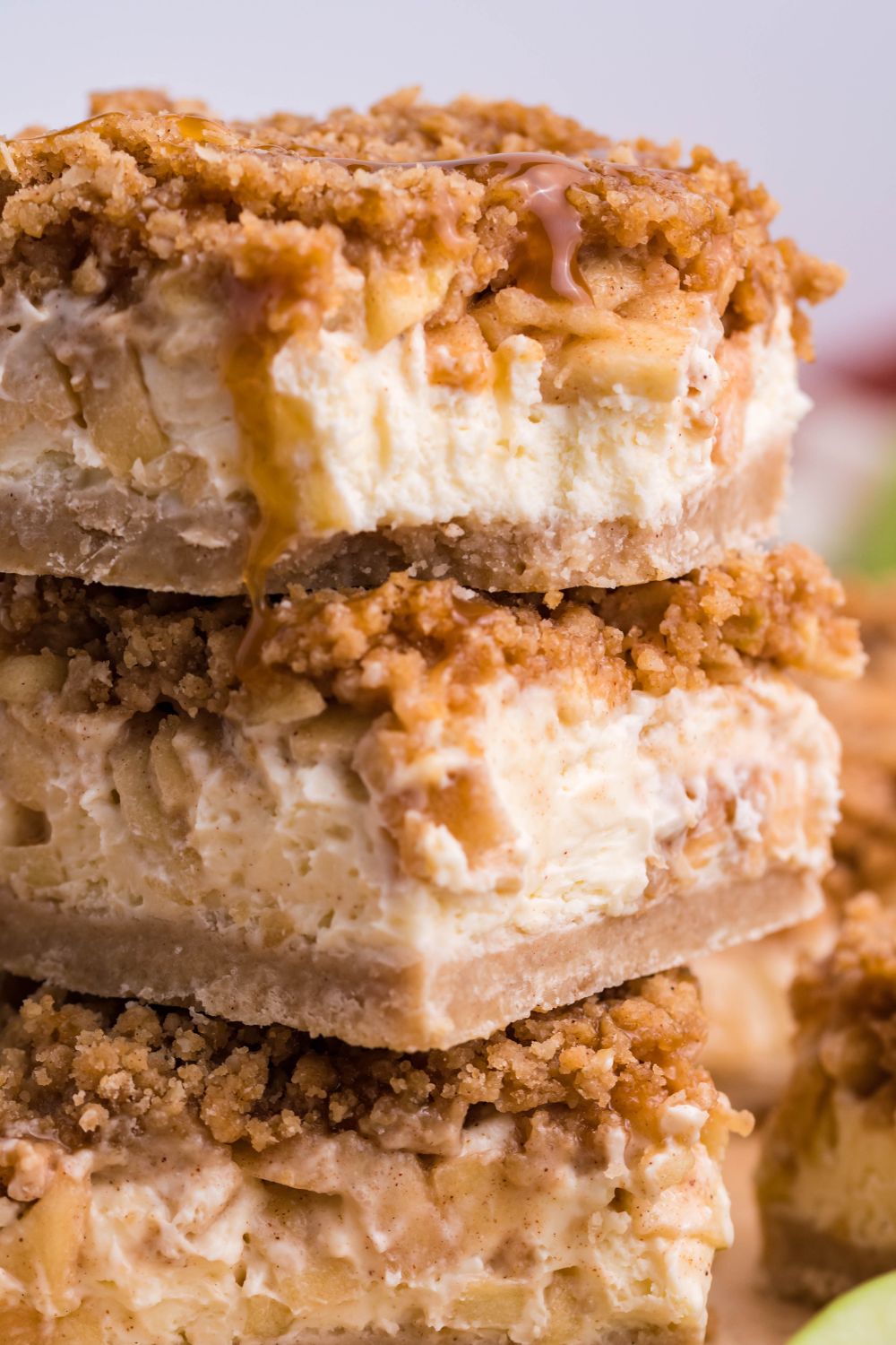 stack of Caramel Apple Cheesecake Bars on table 