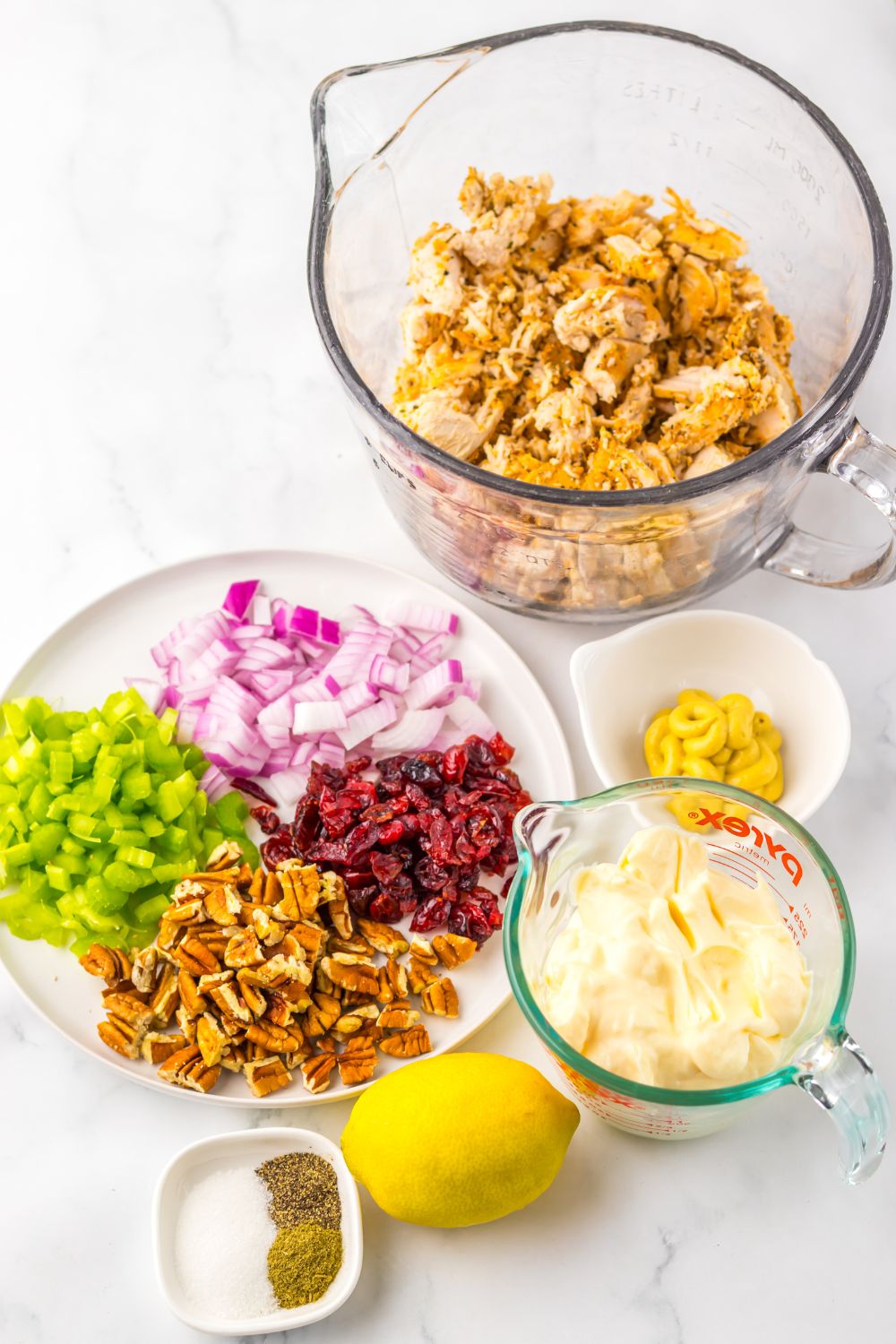 ingredients for making a homemade Thanksgiving Turkey Salad on table in single serve containers 