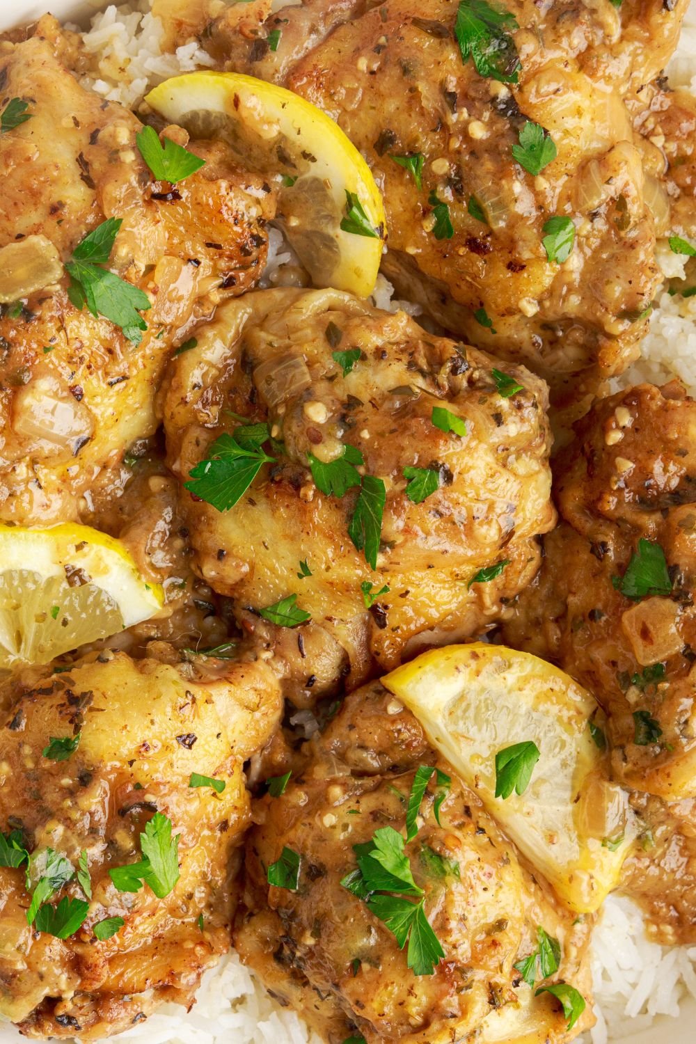 Instant Pot Lemon Butter Chicken on plate with a close up to see how juicy the meat looks 