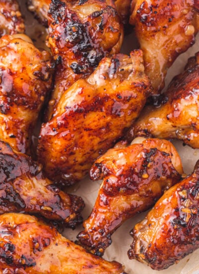 Air Fryer Honey Garlic Chicken Wings all cooked and sauced on a platter