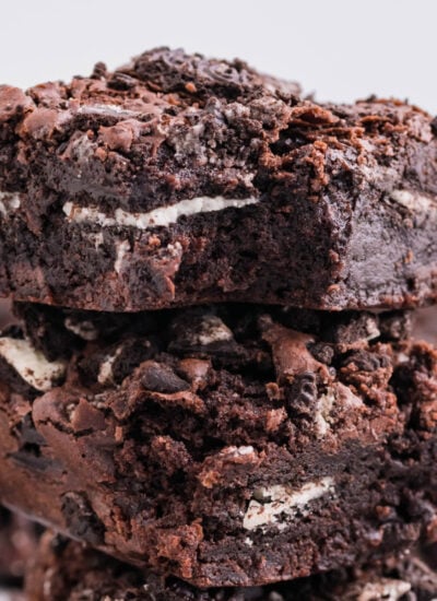Oreo Stuffed Brownies stacked on top of one another on table