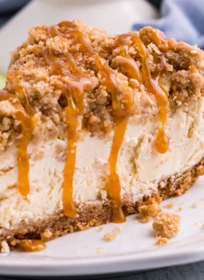 Caramel Apple Crisp Cheesecake slice on a white plate