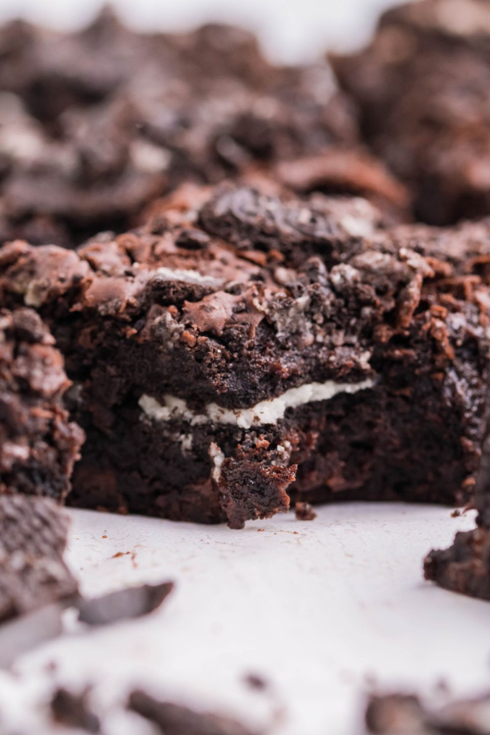 close up of Oreo Stuffed Brownies on table cut into squares 