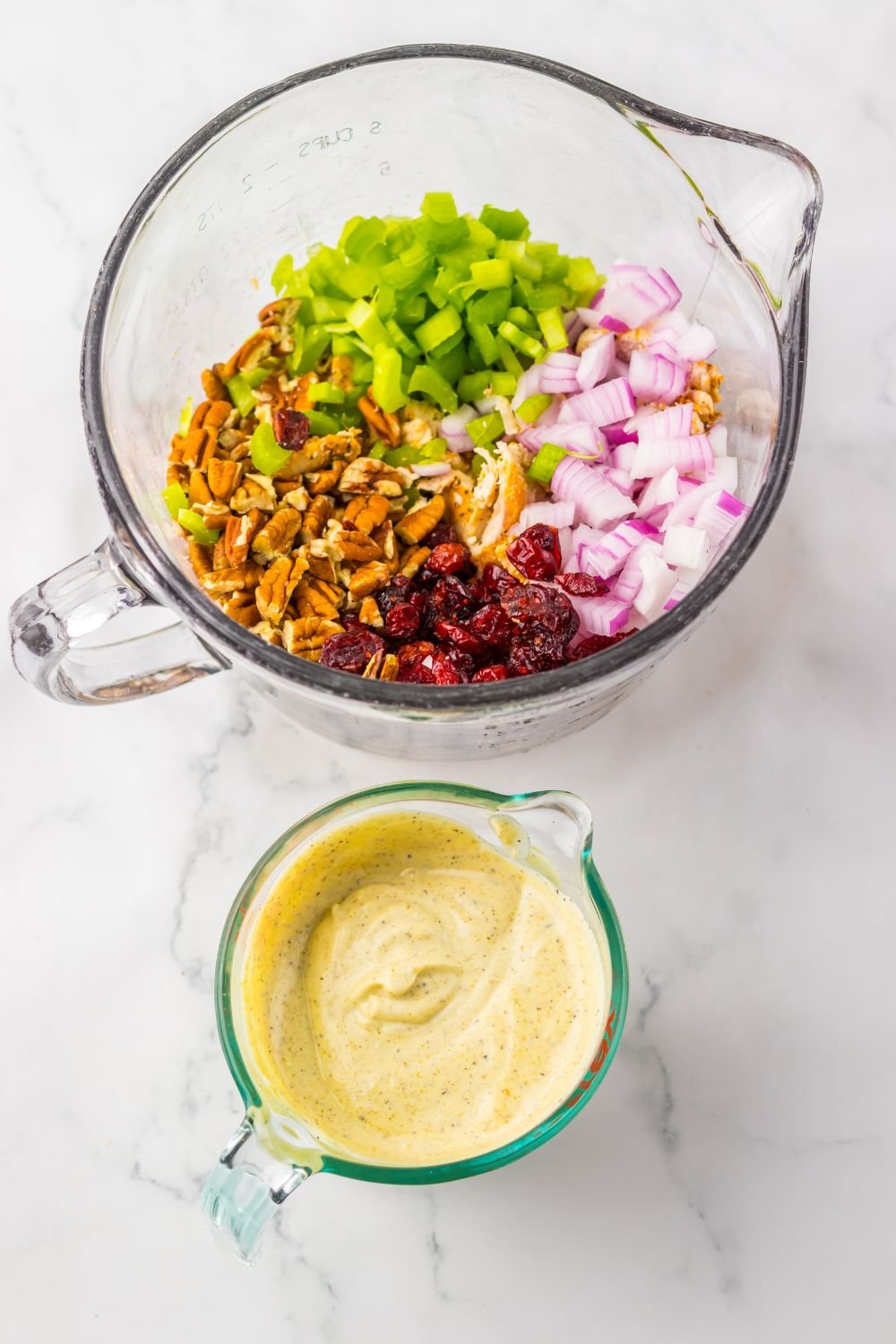 sauce in bowl and other ingredietns in another bowl for making Thanksgiving Turkey Salad