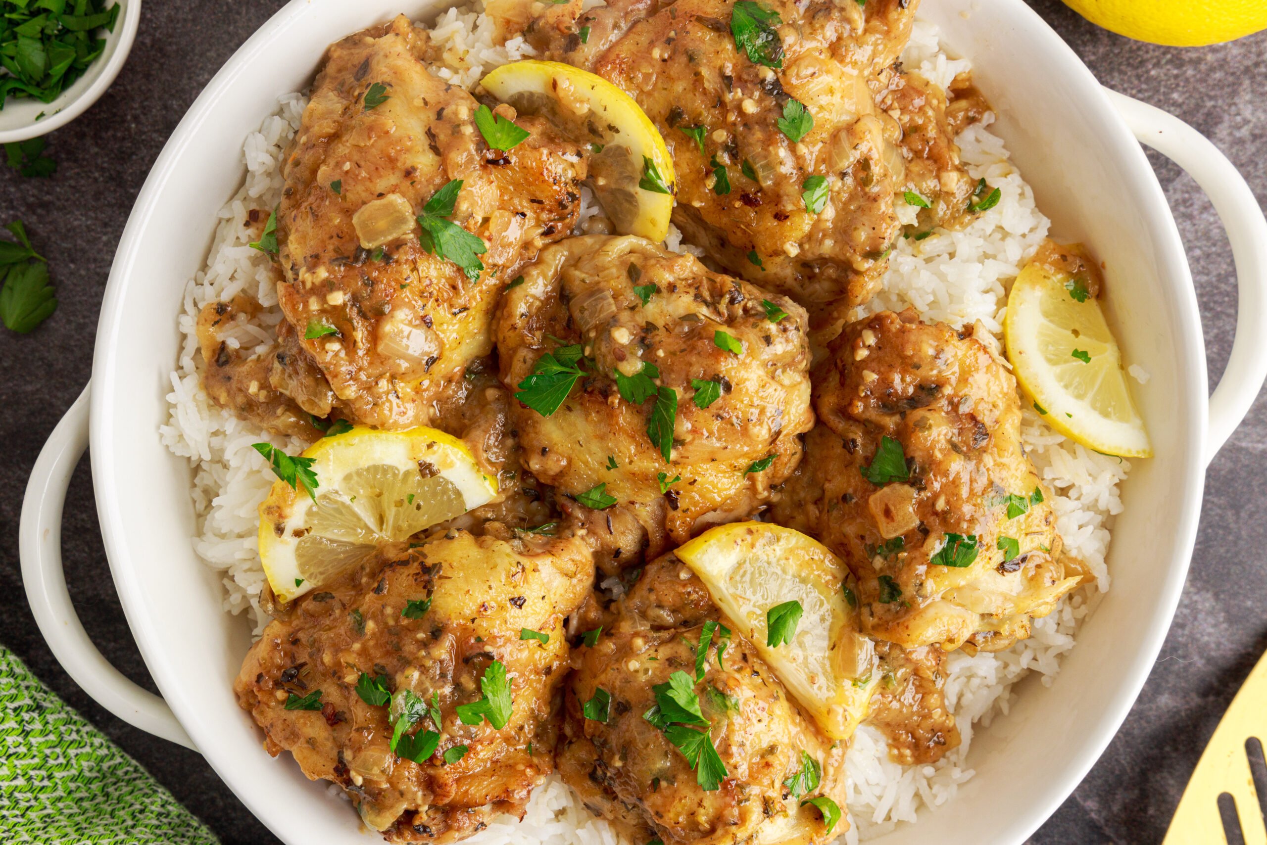 Overhead shot of the Instant Pot Lemon Butter Chicken in a  white serving dish sitting on a table 