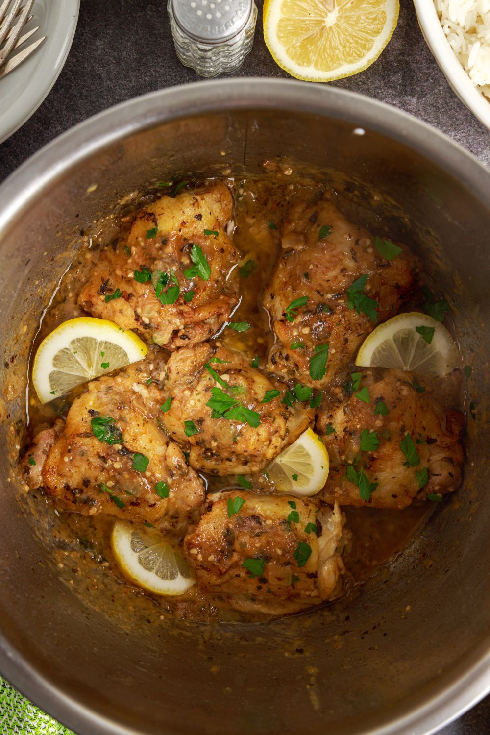 Instant Pot Lemon Butter Chicken in an instant pot topped with some sliced lemons 