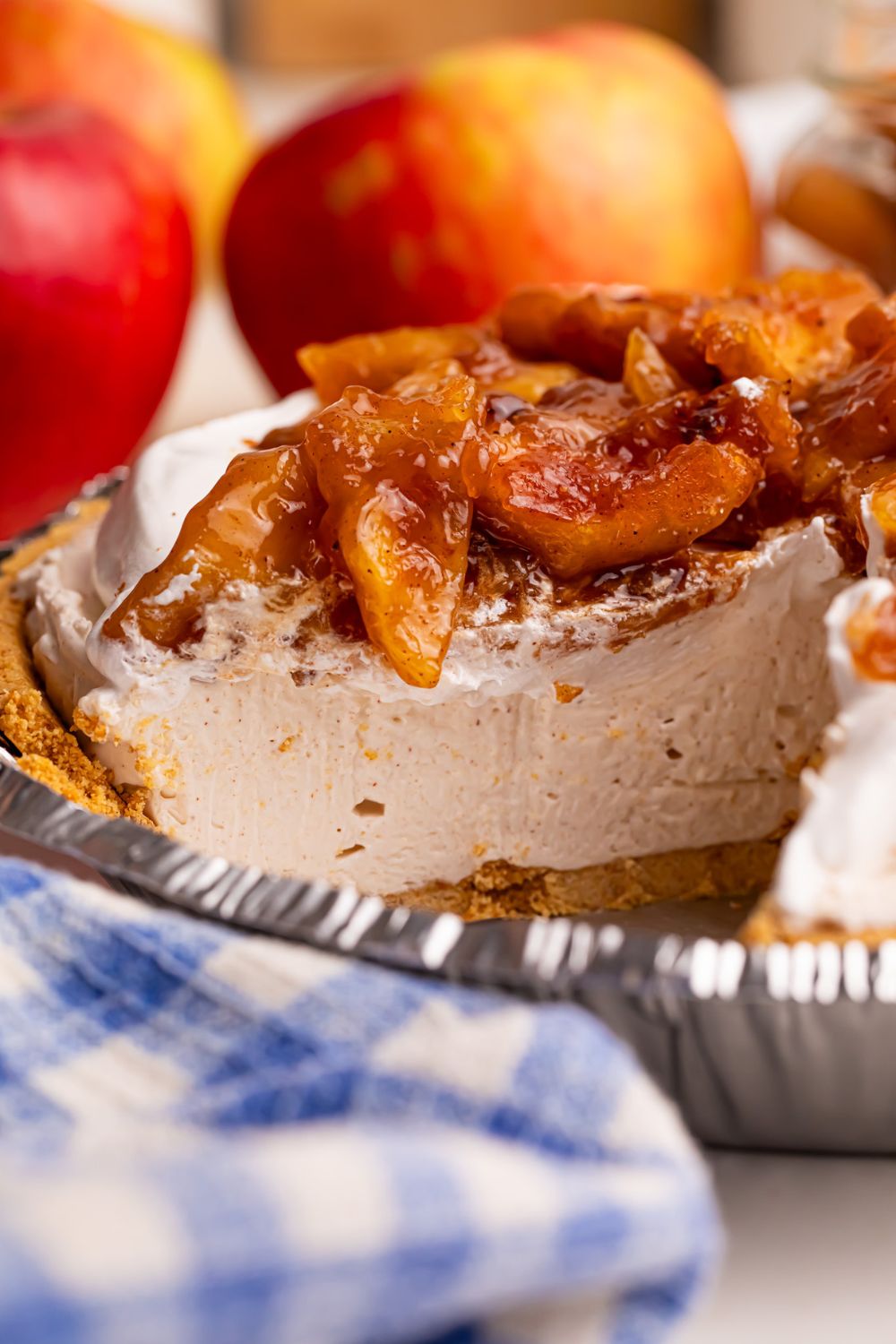 view of No Bake Apple Cheesecake pie with a slice missing out of it 
