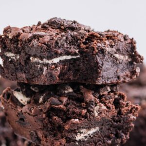 Oreo Stuffed Brownies stacked on top of one another on table