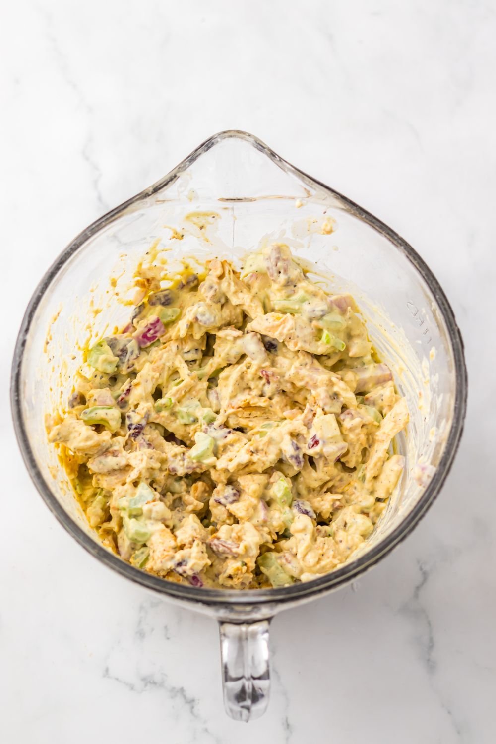 Thanksgiving Turkey Salad mixed up together in a measuring cup 