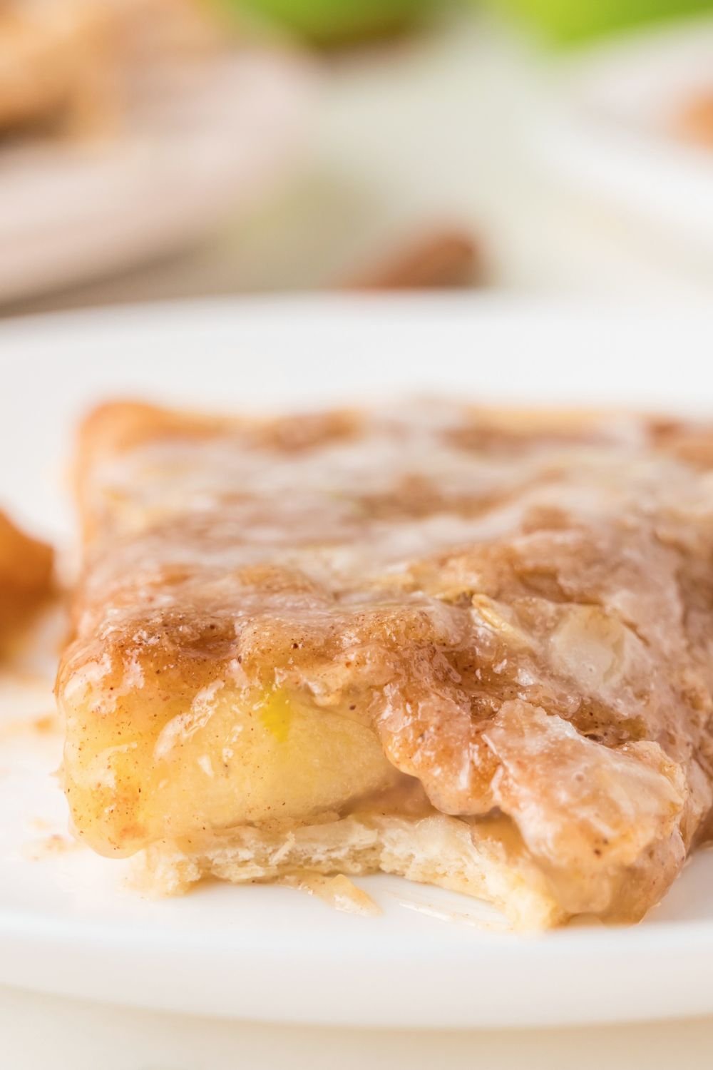 Apple Pie Pizza on plate with a bite taken out of it 