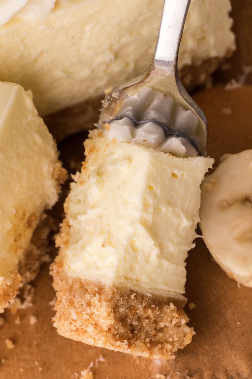 fork with a bite of No Bake Banana Pudding Cheesecake Bar on it 