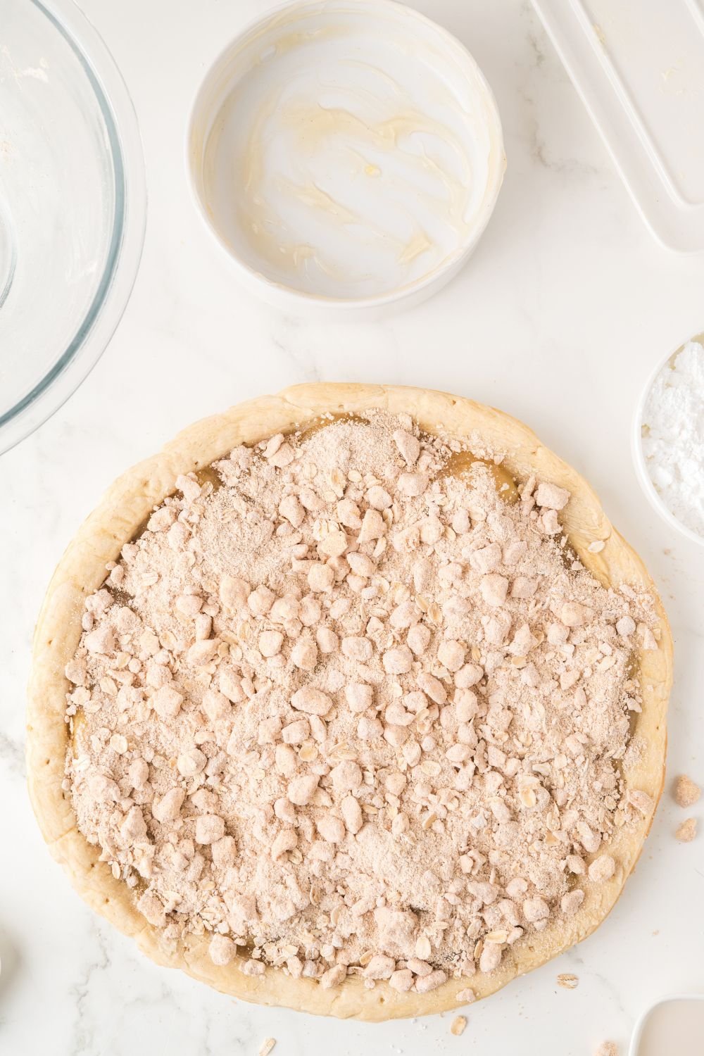 an oat crumble on top of apple pie filling