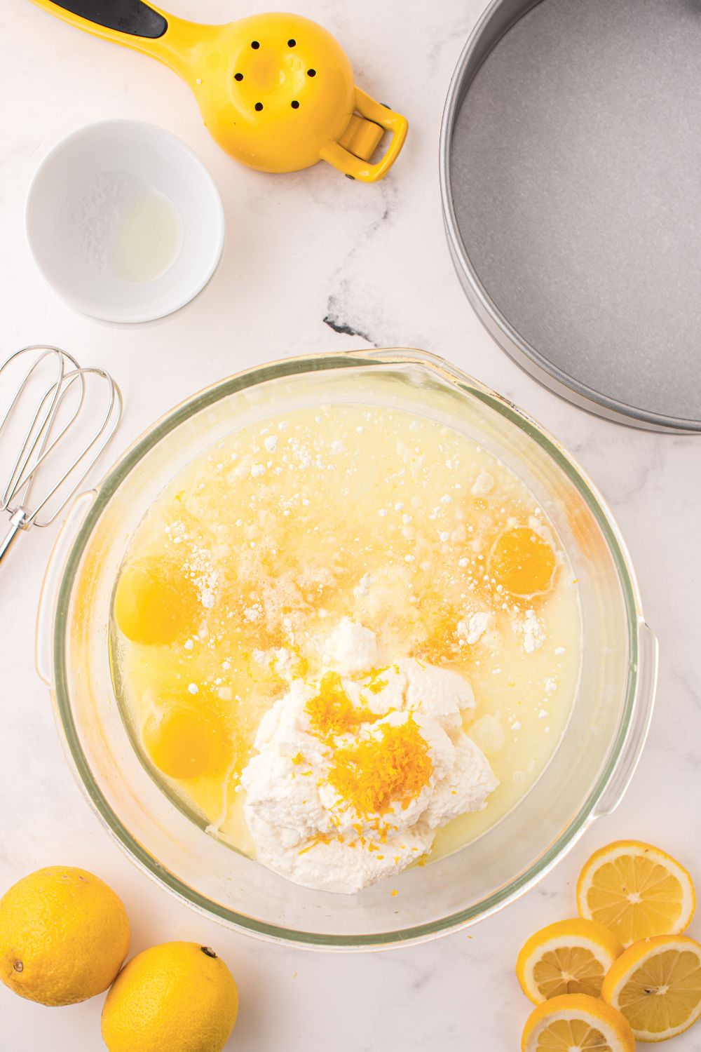 Lemon Ricotta Cake ingredients in a glass bowl on table