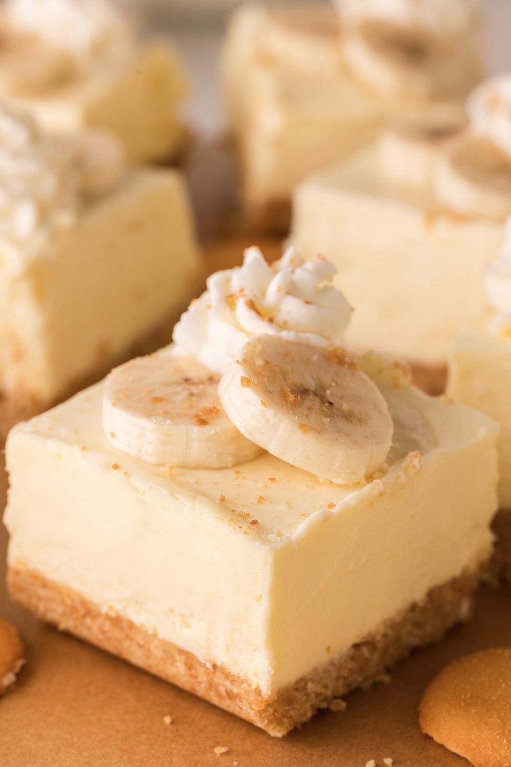 sliced No Bake Banana Pudding Cheesecake Bars cut into squares nicely placed on table 