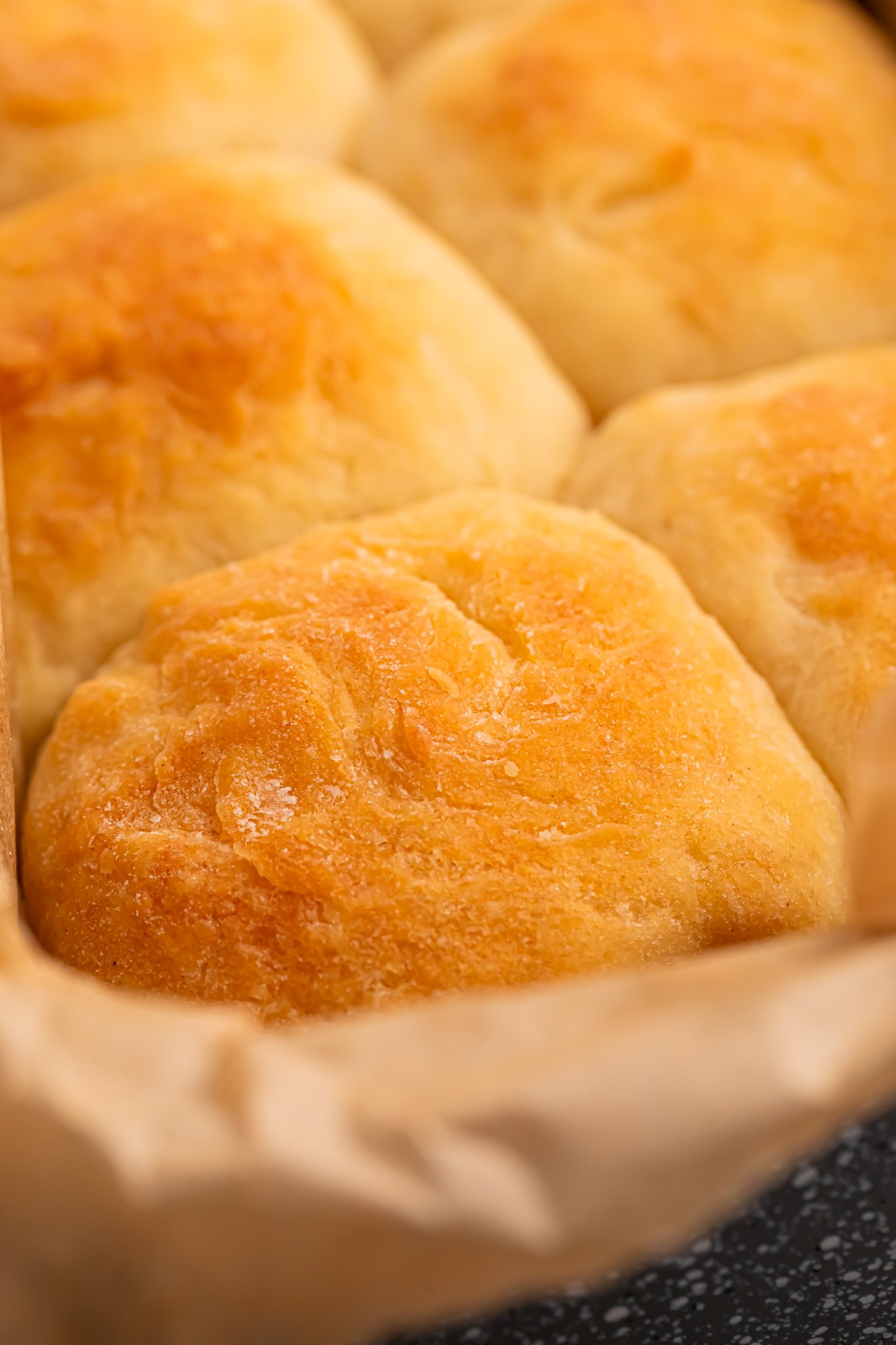 2 ingredient dinner rolls up close showing the golden tops of them