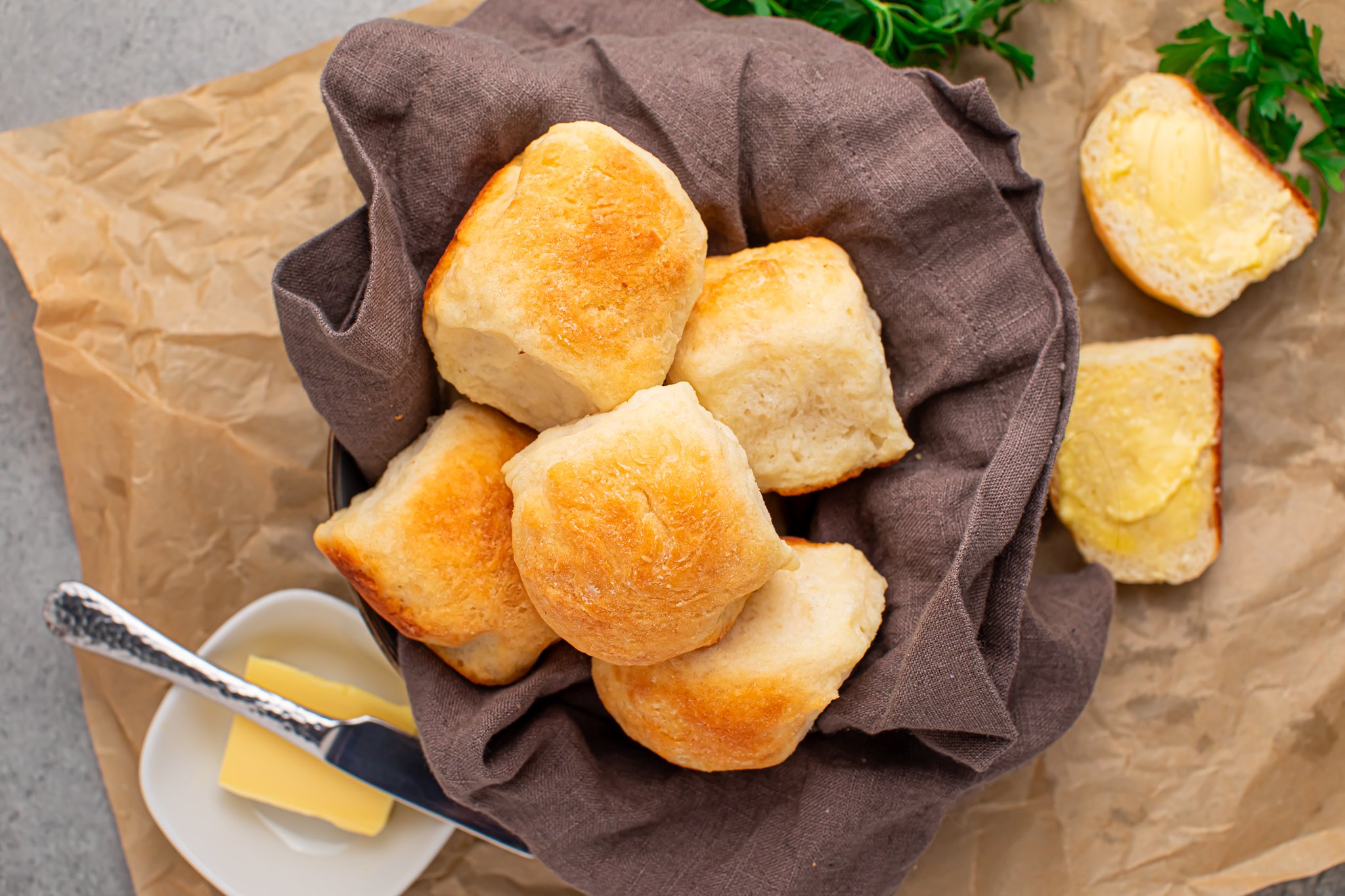 2 ingredient dinner rolls in a bread basket with a side of butter