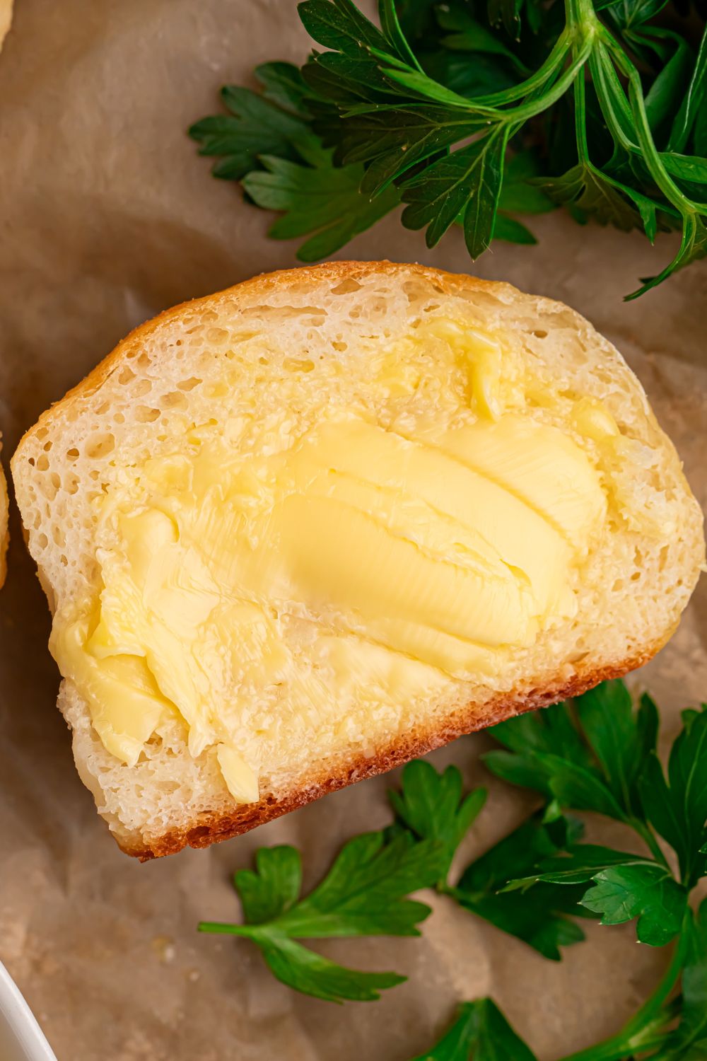 2 Ingredient Dinner Roll on table slathered with butter 