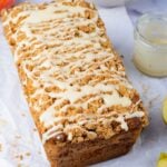Apple Cinnamon Loaf Cake on the table with a jar that had glaze sitting next to it