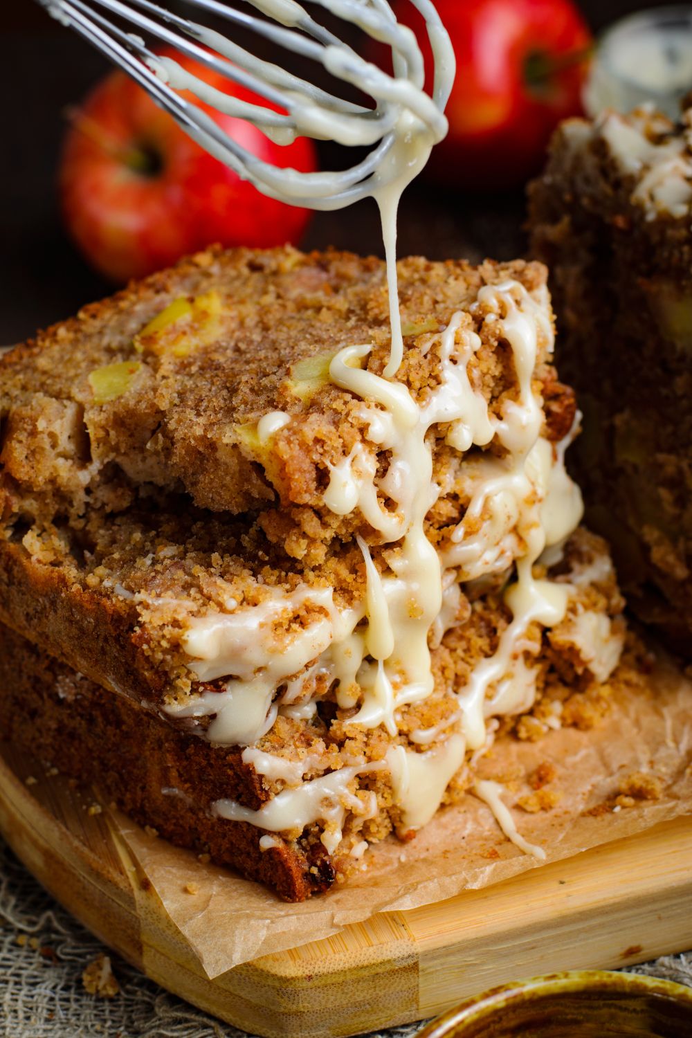 Apple Cinnamon Loaf Cake stacked 3 pieces and a bit of a glaze drizzling down onto the bread 