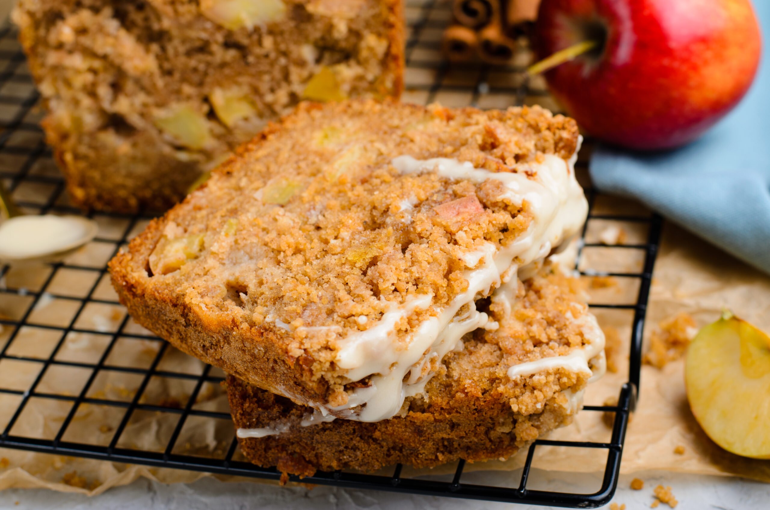 close up view of 2 slices of the Apple Cinnamon Loaf Cake  on a cooling rack