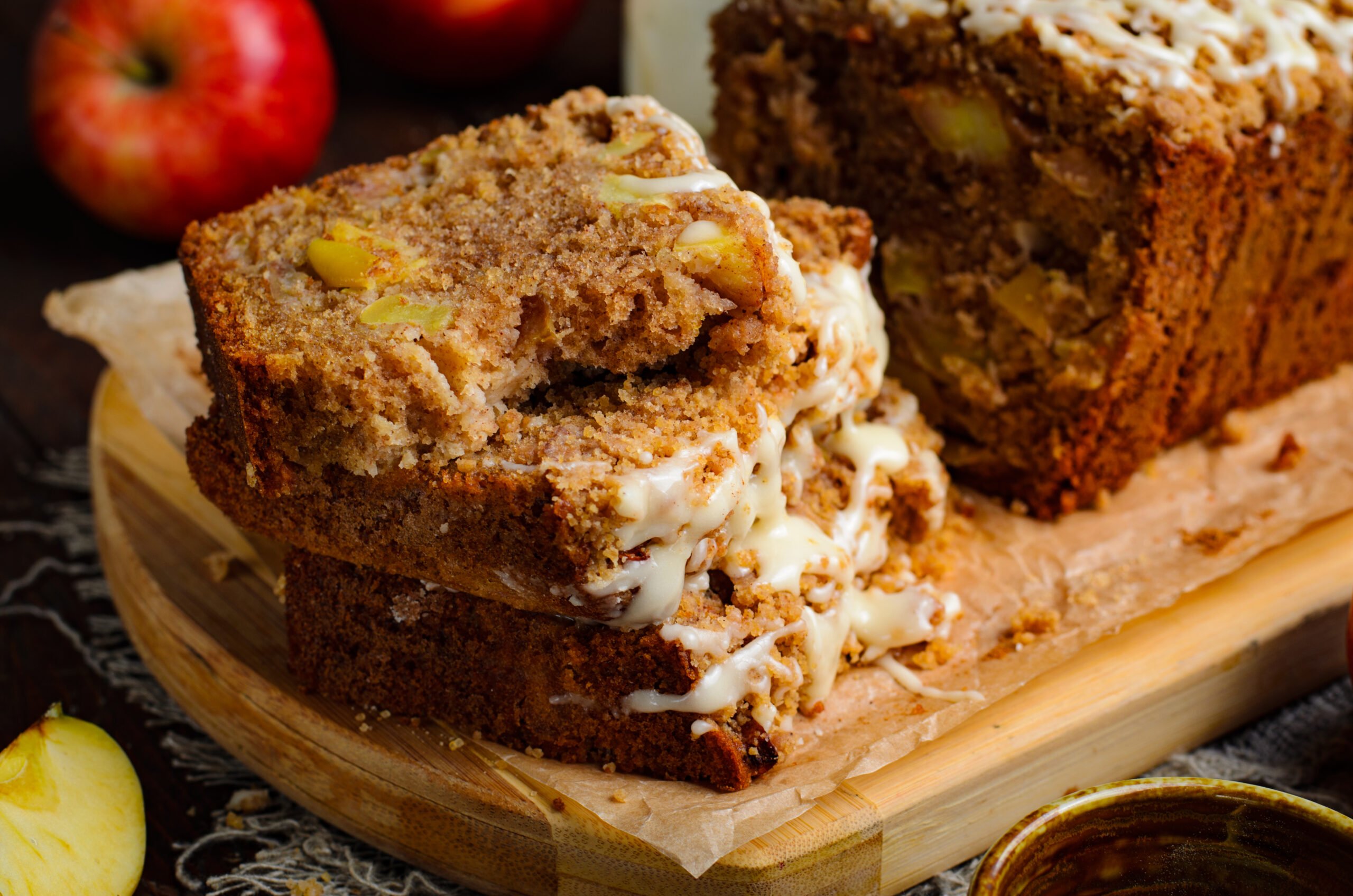 close up view of 4 stacked slices of the Apple Cinnamon Loaf Cake  with glaze