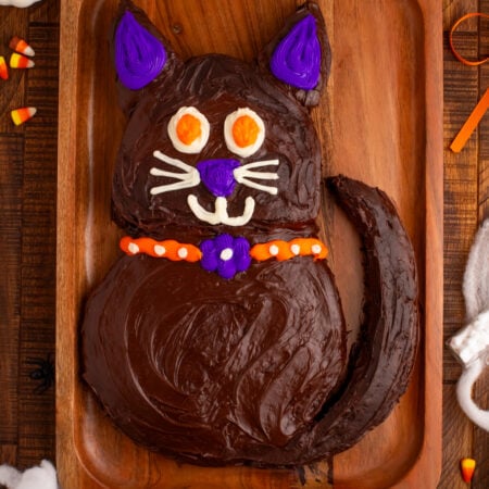 Halloween Black Cat Cut Out Cake on serving tray sitting on table