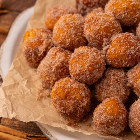 Pile of 2 Ingredient Pumpkin Pie Donut Holes on a serving platter