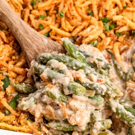 Green Bean Casserole in a white casserole dish sitting on a table